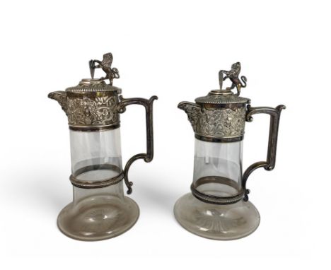 A matched pair of Victorian cut glass claret jugs, one with silver mounts, Elkington Co., Birmingham 1885, the other with sil