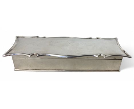 An Edwardian silver stamp box, William Hutton &amp; Sons Ltd, Birmingham 1909 Of rectangular form with shaped lid enclosing s