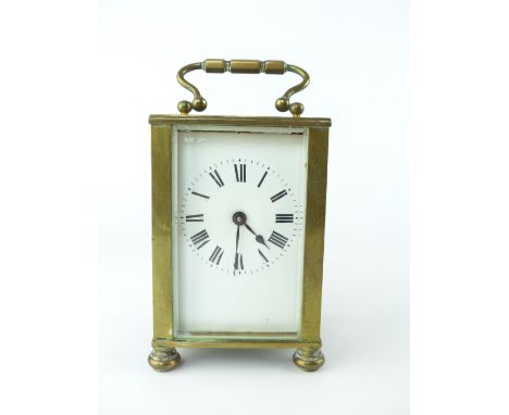 Brass four glass carriage clock, enamel face, Roman numerals, bun feet, 10cm h.