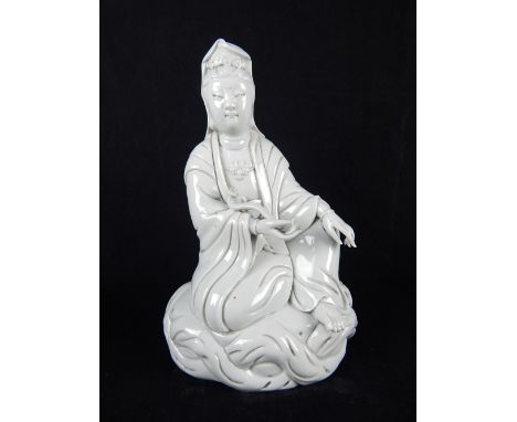 Chinese ceramic sculptural study of guan yin holding a ruyi scepter, impressed stamp to back, 24cm h