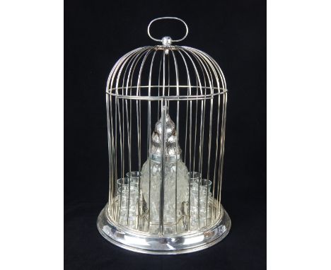Novelty clear glass decanter modelled in the form of a parrot with silver plated head, within a domed cage and including glas