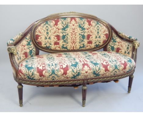 French Empire sofa, brass rose and leaf decoration, ram's head arms, further ribbon and acanthus decoration, tapering legs an