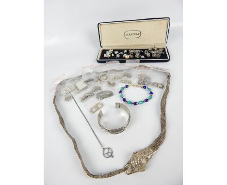 Small quantity of silver and white metal jewellery including a North African belt, bangle and sundry pendants, (qty)