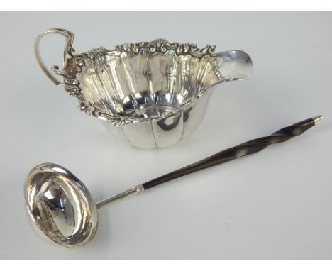 SIlver cream jug, Sheffield 1923 James Dixon, gadrooned with a foliate rim, together with a Georgian toddy ladle circa 1760, 