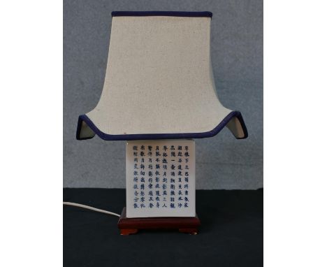 Chinese porcelain lamp decorated with Chinese caligraphy raised on hardwood base H.42 W.31 D.23cm 