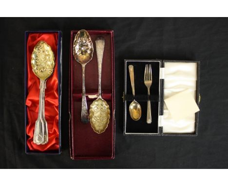 Two pairs of gilded silver plated berry spoons and a cased set of silver child's spoon and fork. (Hallmarked: Sheffield) L.13