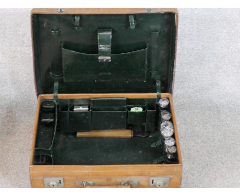 A vintage tan leather Drew &amp; Sons of Piccadilly traveling vanity set. Dark green leather interior and compartments contai