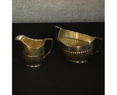 An Edward VII gadrooned silver sugar bowl and milk jug. Hallmarked: William Hutton &amp; Sons Ltd, London, 1905. Weight 360g 