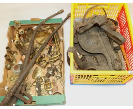 Collection of brassware including horse brasses and candlesticks, a heavy horse bridle, a hammered copper caddy spoon, and a 