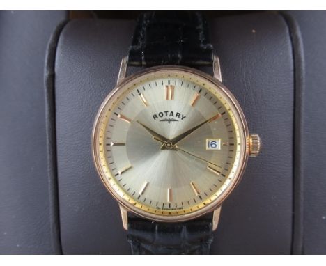 Rotary gold quartz wristwatch with date, signed two tone sunray dial with applied baton hour markers, two piece case on origi