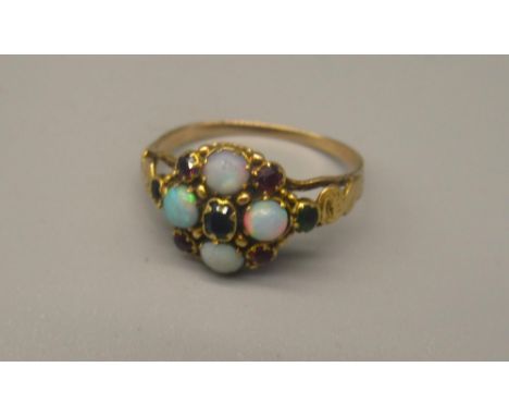 Victorian yellow metal opal cluster ring, set with opals, sapphires, rubies and green stones on engraved band, no clear hallm