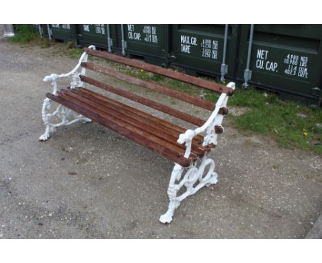 Coalbrookdale cast metal garden bench, ends depicting serpent, leaves and dogs head, wooden slats, W158cm D34cm H75cm 