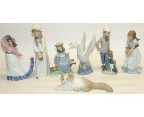 Nao by Lladro porcelain figures: Tulip Time, Swan, boy with dog, Angora's Cat, Friendly Advice, Caught in the Breeze, and Gir