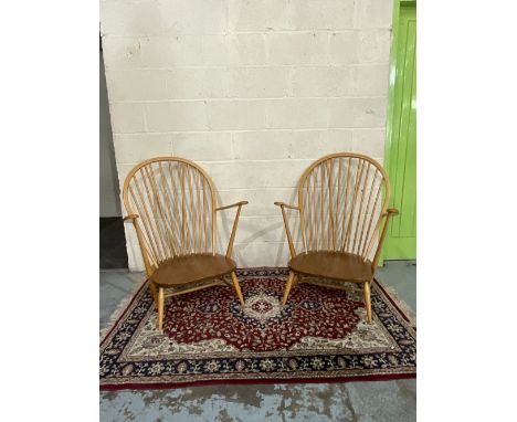 Pair of Ercol light elm and beech armchairs, with blue labels (2) 