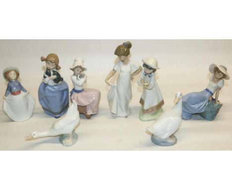 Nao by Lladro porcelain figures: Girl with Sleepy Puppy, two ducks, Girl Picking Up Her Skirt, A Big Hug, and three others (8