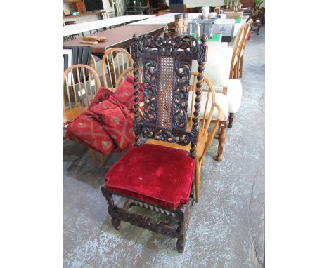 C17th style oak dining chair, with scroll carved and bergere panel back and seat on barley twist and block supports joined by