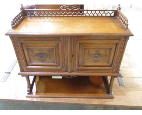 Edwardian walnut wall cabinet, galleried top and two carved panel doors with fitted interior above a shelf, W57cm D23cm H55cm