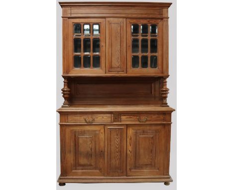 Victorian pitch pine side cabinet, moulded cornice and two nine panel glazed doors above an open waist, the base with two dra