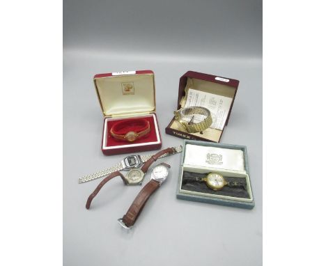 Timex gold plated quartz wristwatch, signed cream dial with centre seconds. D33mm. Ladies Omac LCD quartz wristwatch and four