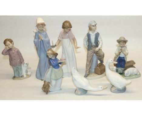 Nao by Lladro porcelain figures: boy shepherd, girl with candle, Shoeshine Boy, Girl Praying, Sleepy-Head, and Puppy's Birthd