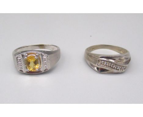 10ct white gold ring set with oval cut citrine, stamped 10k, size T1/2, and another 10k white gold ring set with six brillian