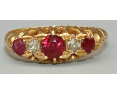 18ct yellow gold five stone ruby and diamond ring, the three round cut rubies separated by two brilliant cut diamonds, in cla