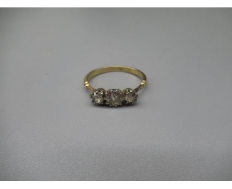 18ct yellow gold three stone diamond ring, stamped 18ct, size R, 2.9g 