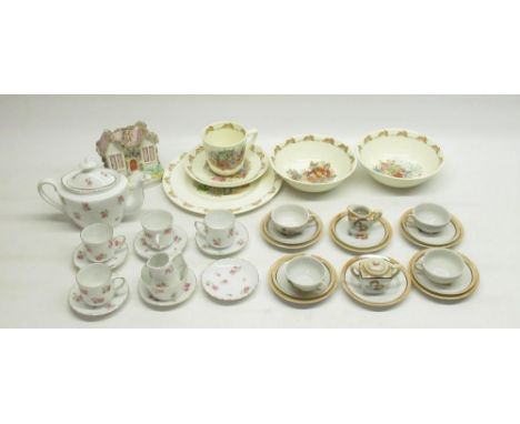 Royal Doulton Bunnykins cup, saucer, 2 bowls and side plate, 2 C20th miniature tea sets, and a ceramic cottage (Qty.) 