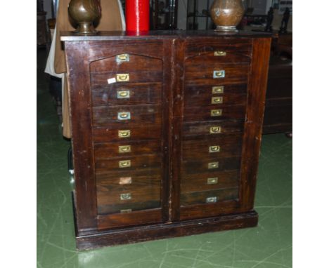 A Victorian specimen chest with 20 drawers enclosed by 2 glass panel doors.
