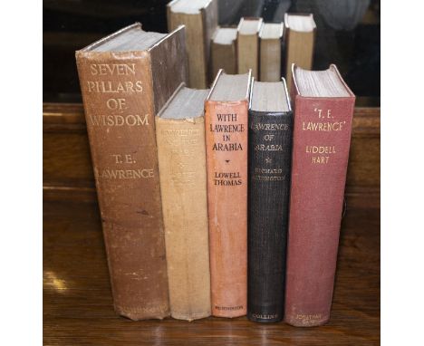 An edition of Seven Pillars of Wisdom by T E Lawrence together with four other related books (book trough not included)