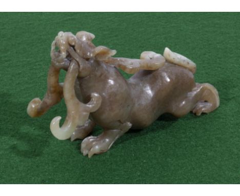 A Chinese jade carving of a mythical beast