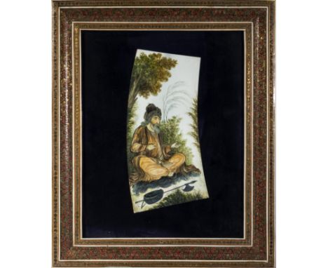 A framed Chinese ivory panel depicting a hunter at rest