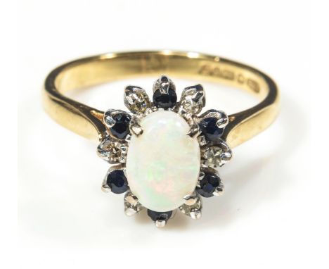 An 18ct yellow and white gold opal, diamond and sapphire cluster ring, size P