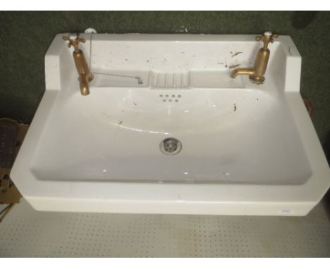China wash hand basin and pair of brass taps