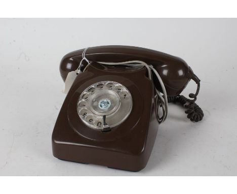 Brown plastic rotary dial telephone, 24cm wide