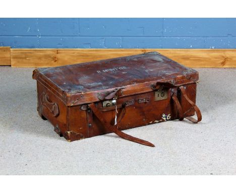 Early 20th century brown leather travelling trunk, the hinged lid enclosing a lift out tray, named to R. McIntyre, 83cm wide