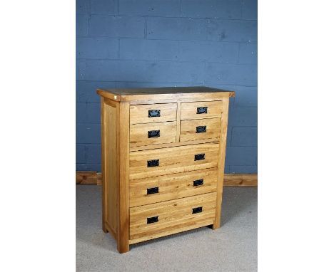 Modern light oak chest of four short and three long drawers, 98cm wide