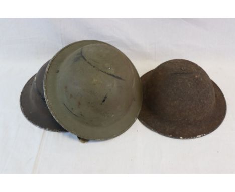 A Collection Of Three Vintage British Military Brodie Helmets, All Complete With Chin Straps.
