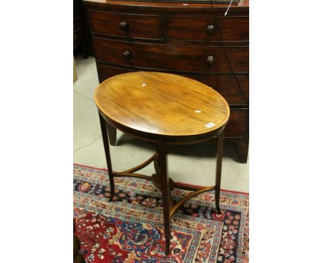 Edwardian Mahogany Inlaid Oval Side Table, the slender square legs united by a pierced shelf, 82cms long x 71cms high