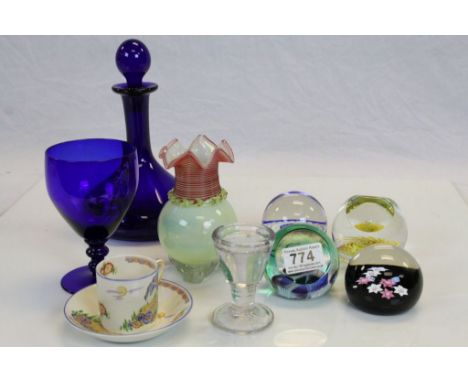 A Thomas Webb blue glass decanter and wine glass, four paperweights to include Caithness ,an art glass vase a penny lick toge