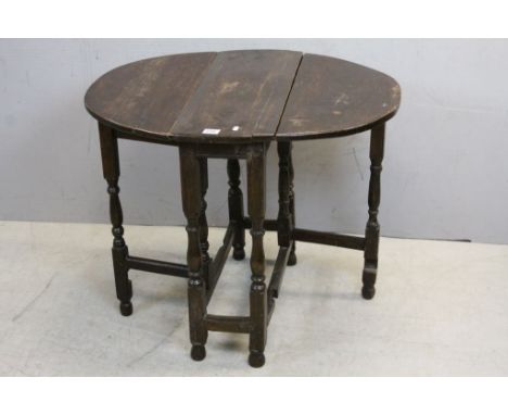 Small 18th century Oak Oval Gate-leg Table raised on turned baluster and block supports, 68cms wide x 86cms long x 68cms high