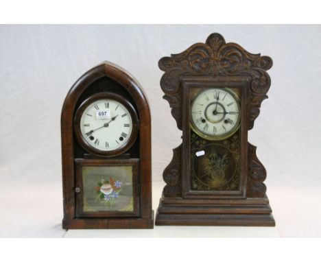 Antique carved oak gingerbread two train mantle clock and an antique Rosewood veneerer bracket clock of arched form 