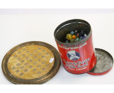 Vintage Wooden Solitaire board and an old Cow &amp; Gate Milk food tin with a collection of glass marbles to include 19th Cen