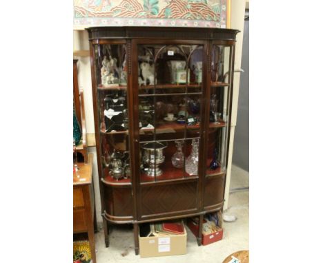 Edwardian Mahogany Display Cabinet with curved glazed sides, the single door opening to reveal three red velvet covered shelv