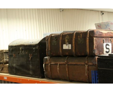 A vintage dome top canvas trunk and two wooden bound and canvas suitcases 