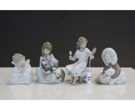 Four vintage Lladro ceramic Figurines to include Inuit child with Polar Bear, Girl with Cats, winged Child &amp; girl with Ha