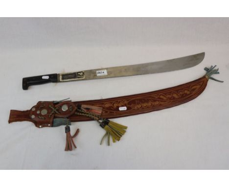 A Vintage El Gavilan Columbian Machete With Detailed Decorative Leather Sheath.