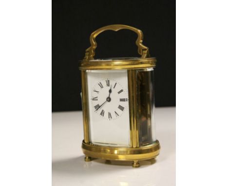 Oval cased vintage Brass Carriage Clock with bevelled Glass panels &amp; Enamel dial, measures approx 11 x 9 x 6.5cm excludin