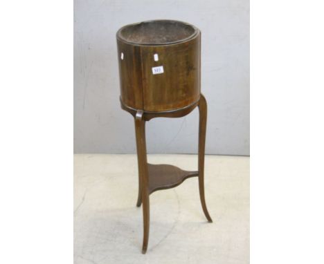 Early 20th century Mahogany Inlaid Circular Plant Stand with Metal Liner and raised on Three Slender Legs united by a shelf, 