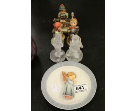 Three Goebel child figurines, two similar glass figures and a Goebel plate with embossed angel 